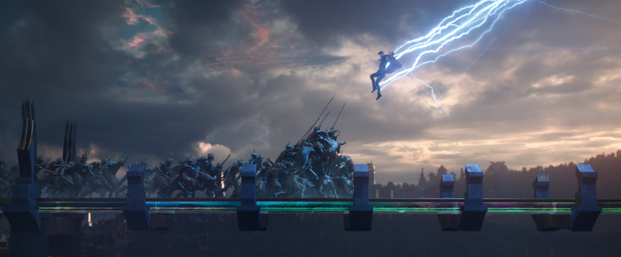 A wide shot of Thor leaping into battle on a bridge