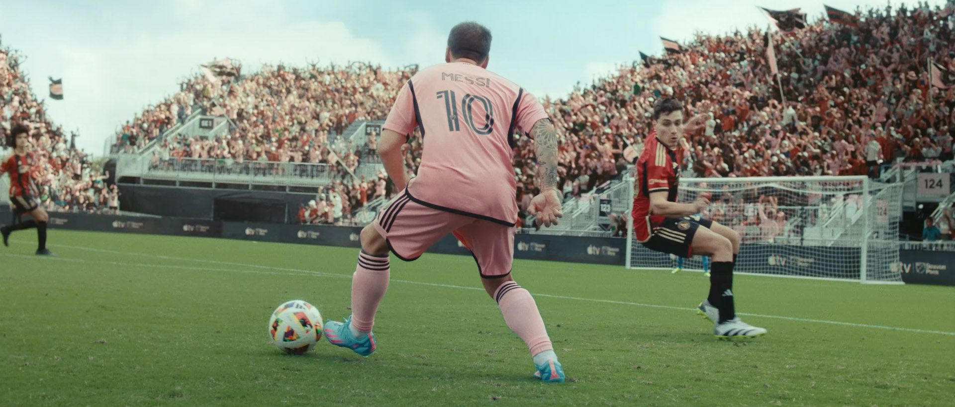 Messi kicking a soccer ball