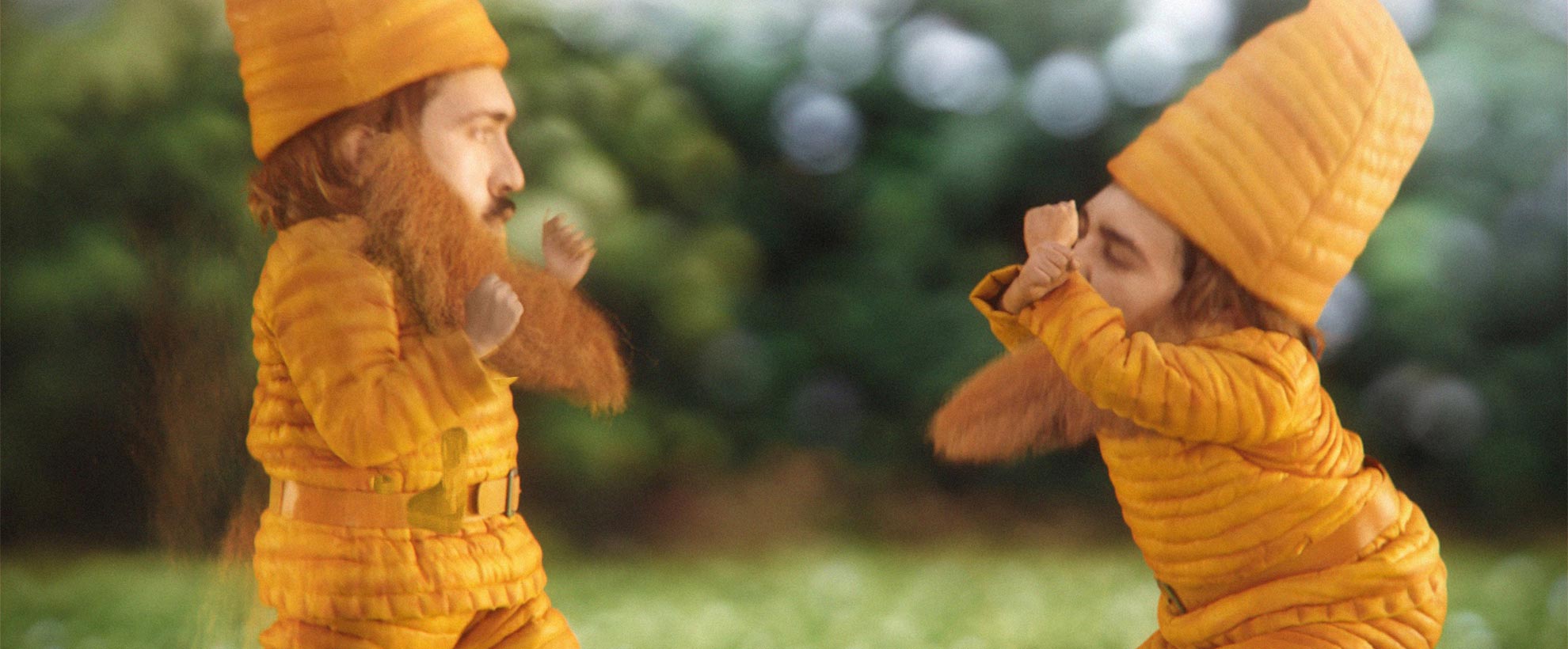 Two CGI garden gnomes dressed in yellow