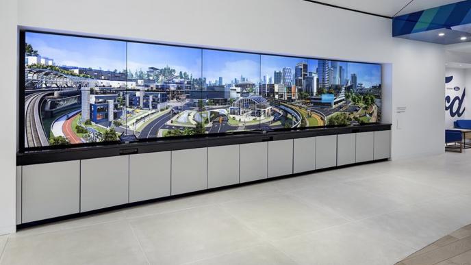 a large vertical screen covering a wall in a ford mobility store