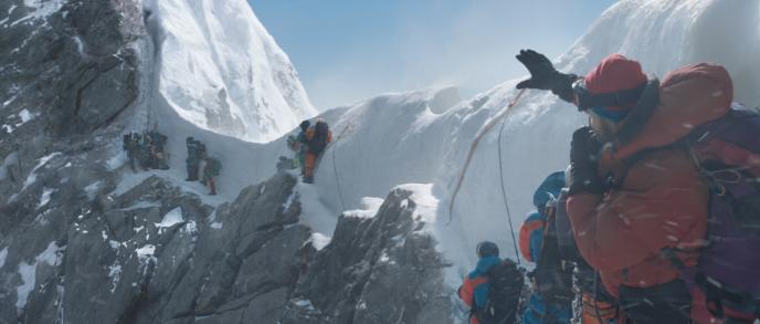 a group of climbers hiking up mount everest