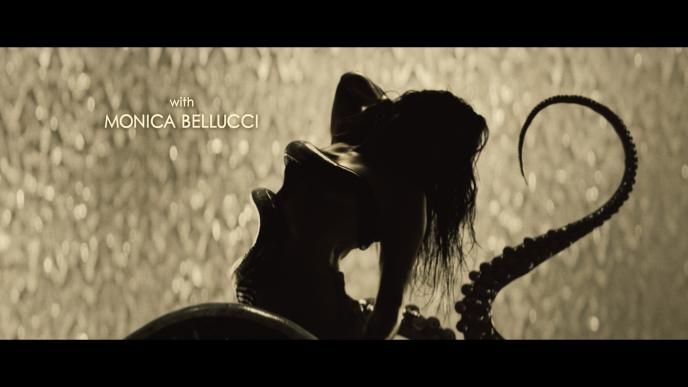 silhoutte of monica belluci. there is an octopus arm on the side