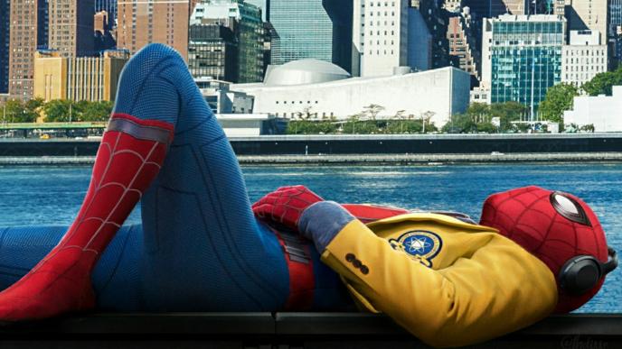 spider-man wearing a yellow jacket and headphones while laying down near a canal over looking the city