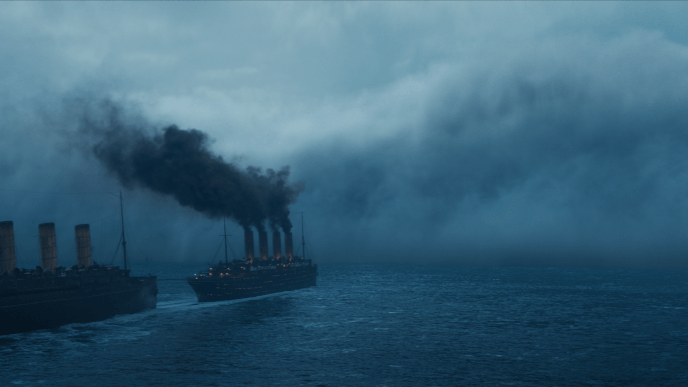 Two ships sail in line on the ocean, billowing black smoke behind them, in Netflix's mystery show 1899