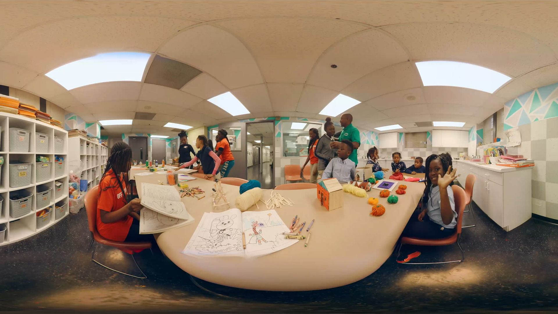360 panoramic shot of a library full of children doing crafts