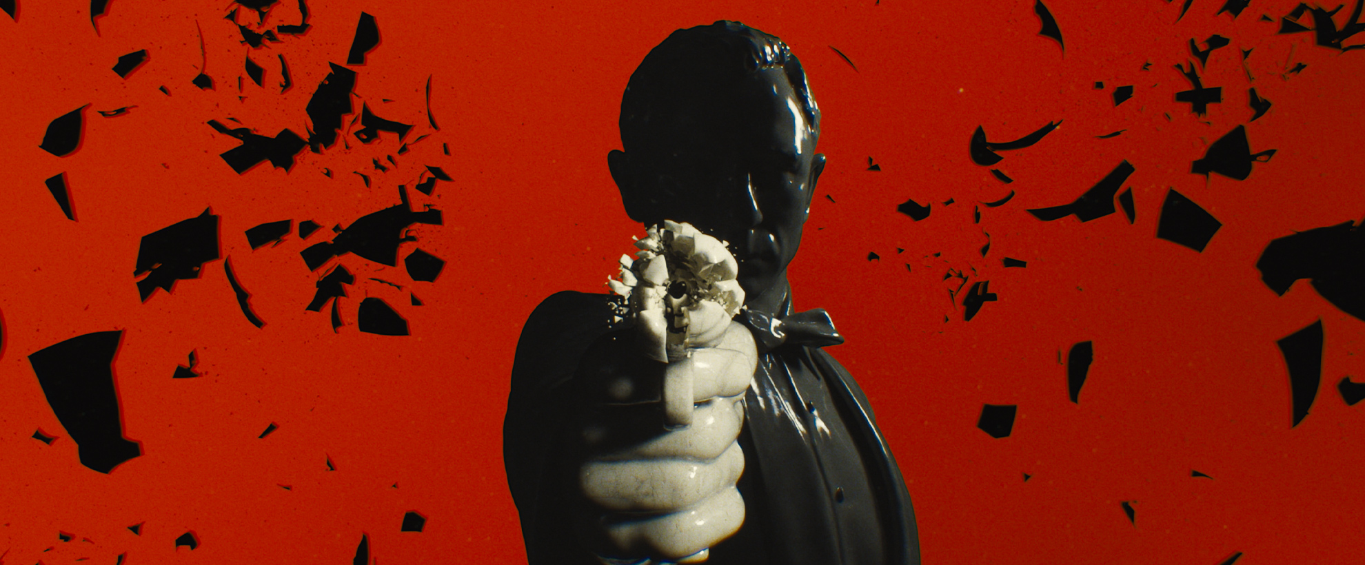 A statue of James Bond fires a gun into the camera, against a red background