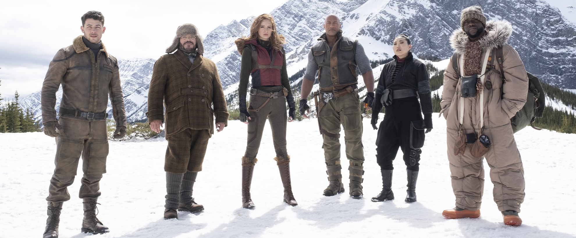 The cast of Jumanji: The Next Level stood on a snowy mountain