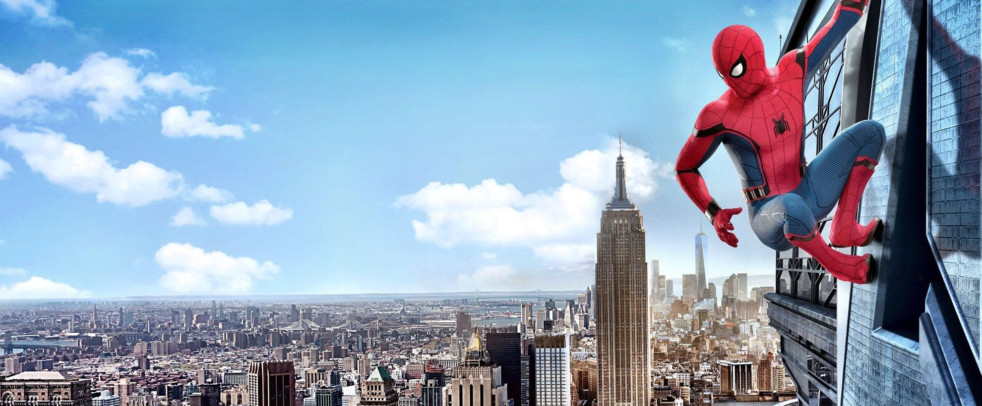 Tom Holland's Spider-Man sits on the side of a building, above a large New York cityscape