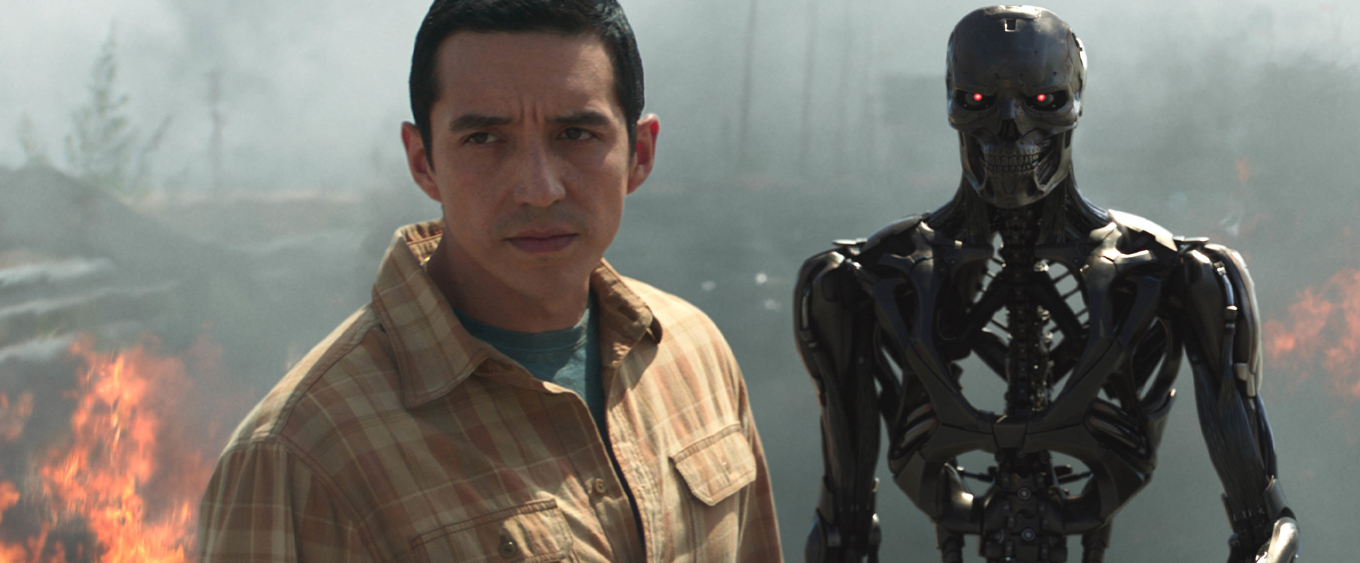 A man and a black skeleton robot 