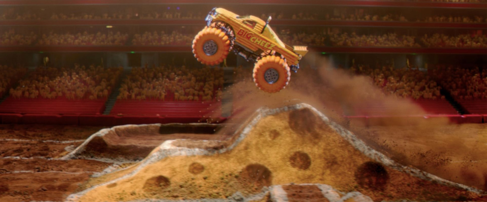 A yellow monster truck take off from a cheese ramp with a crowd in the background.