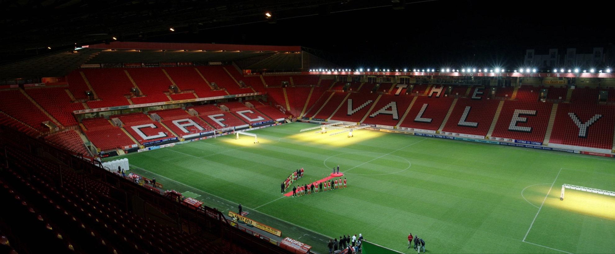 A football pitch lit up at night