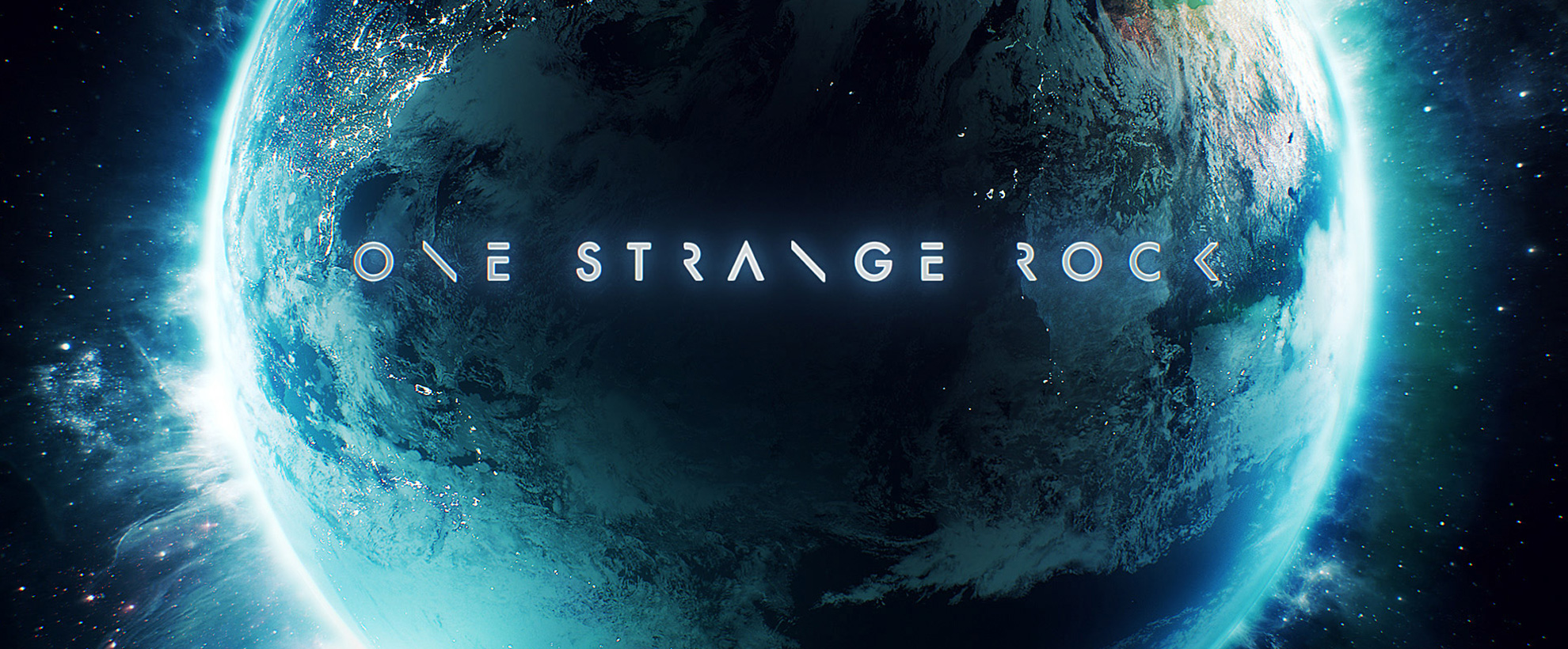 A blue planet in space with "one strange rock" in light blue glowing text