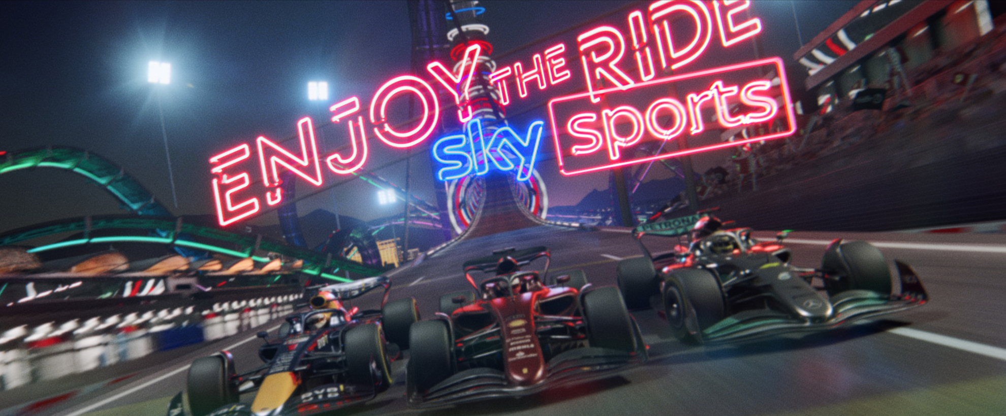 Three F1 cars on a track, in the background "enjoy the ride, sky sports" in neon lettering