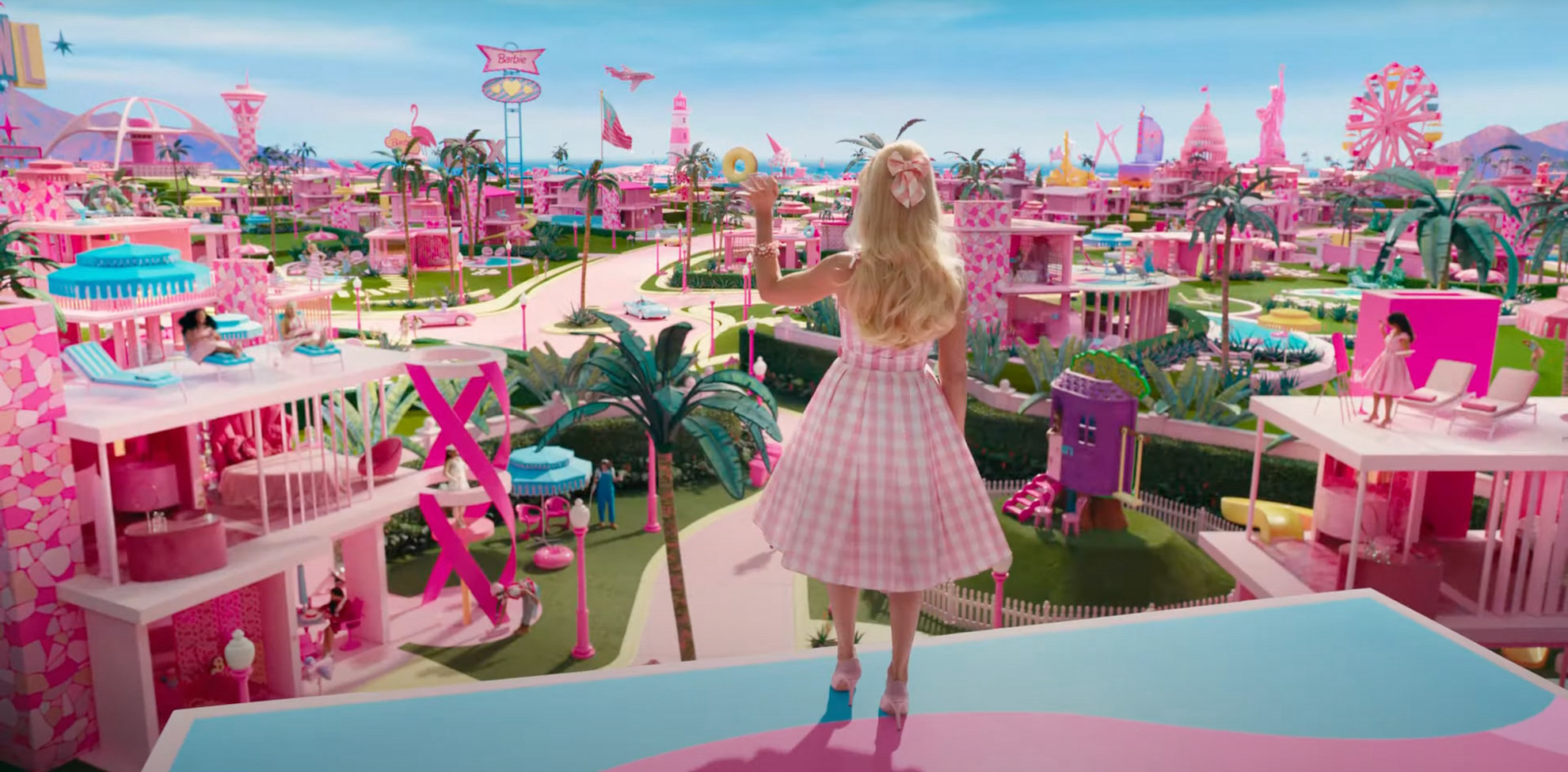 Barbie stands on a roof, overlooking Barbieland