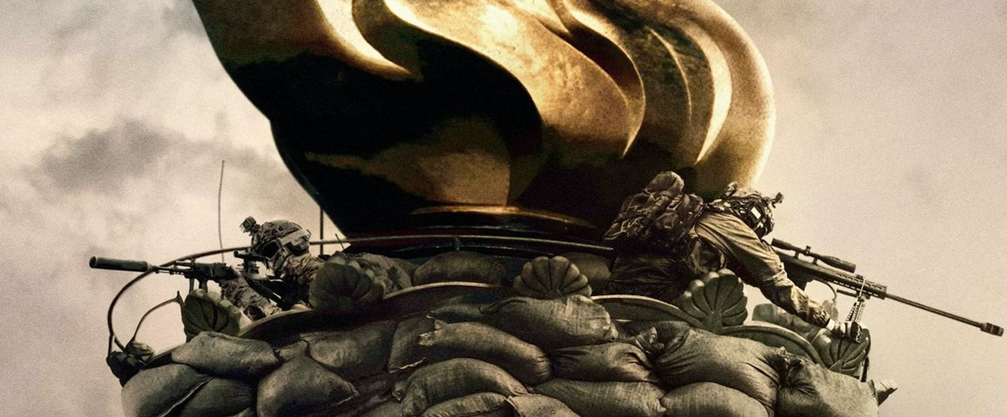 The statue of liberty's torch with soldiers and sandbags 