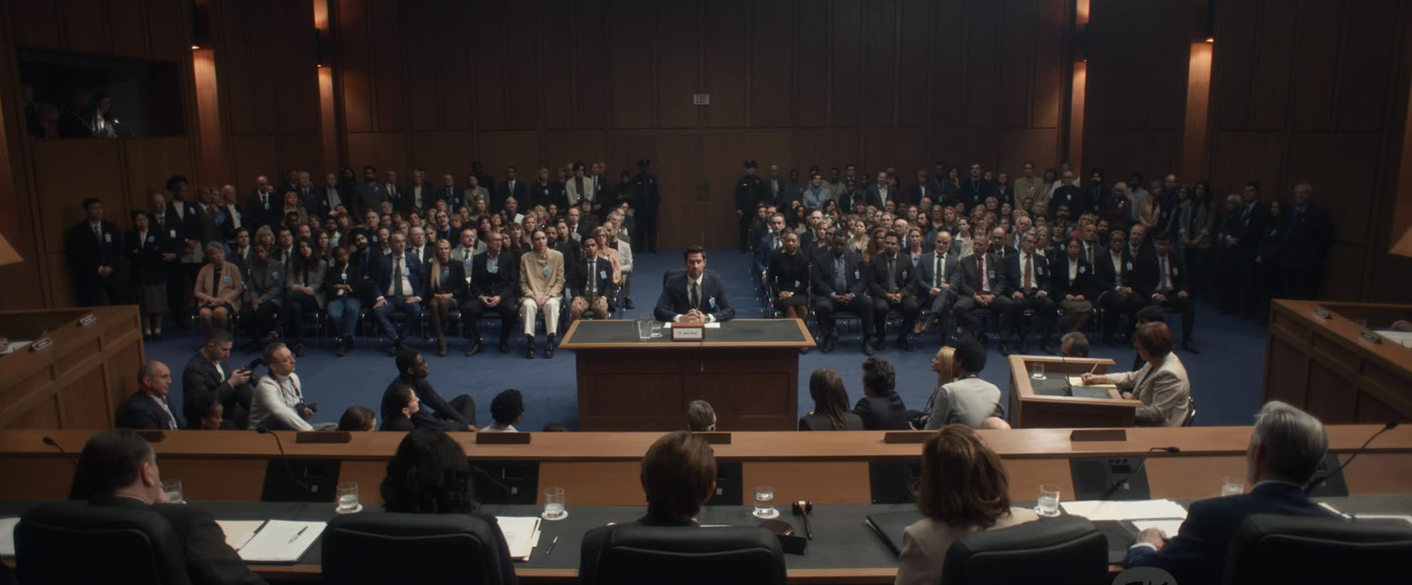 A courtroom full of people during a hearing