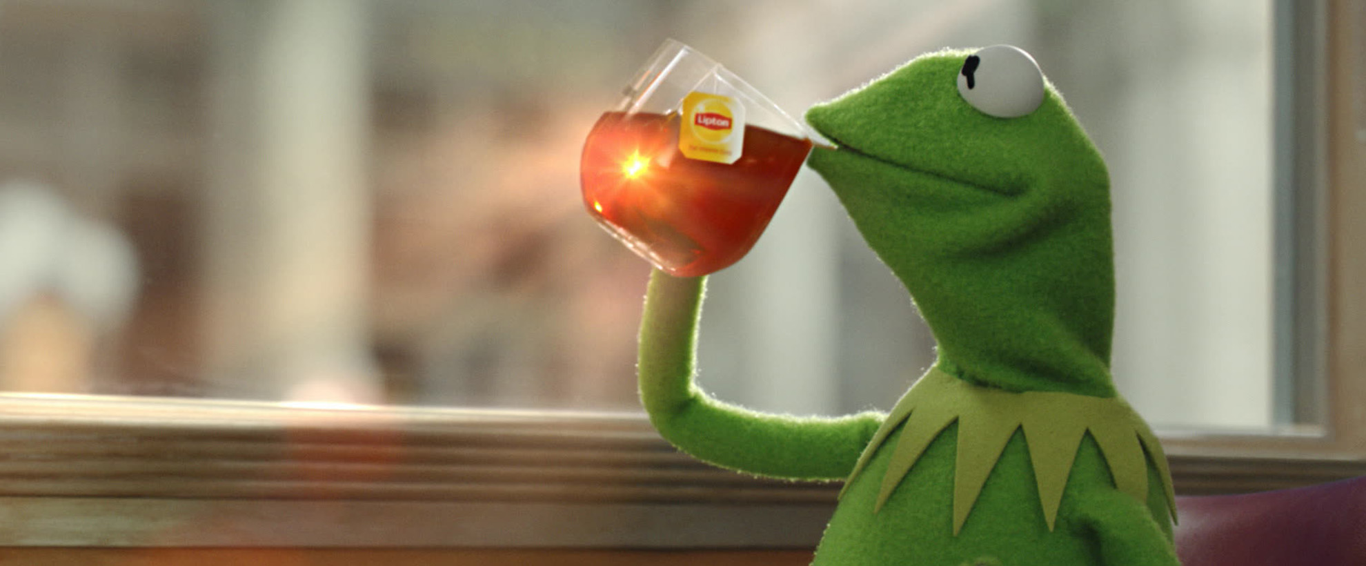 Kermit the Frog sips a mug of Lipton tea