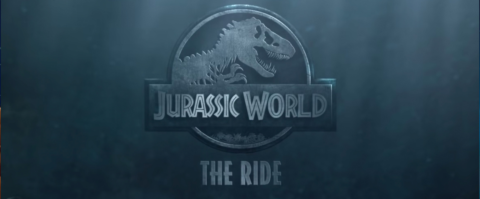 The Jurassic World logo. Gray, worn in background. There is a T-Rex dinosaur in the logo. It says Jurassic World and underneath it says The Ride