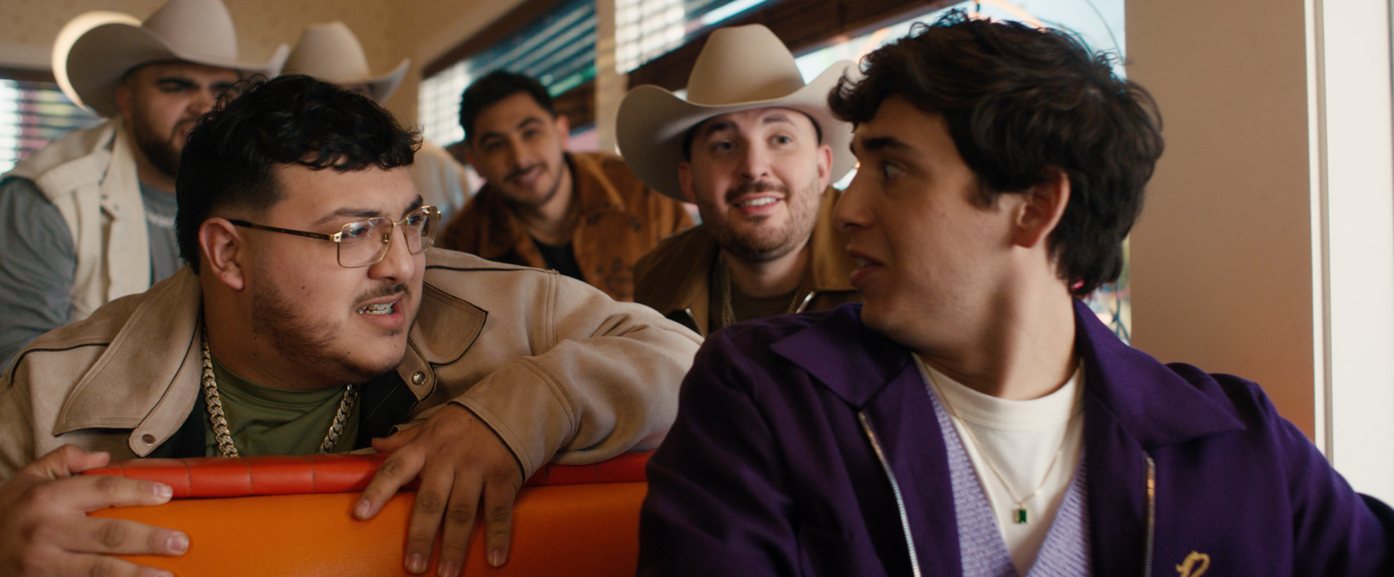 Marcello Hernández and Grupo Frontera in a diner booth