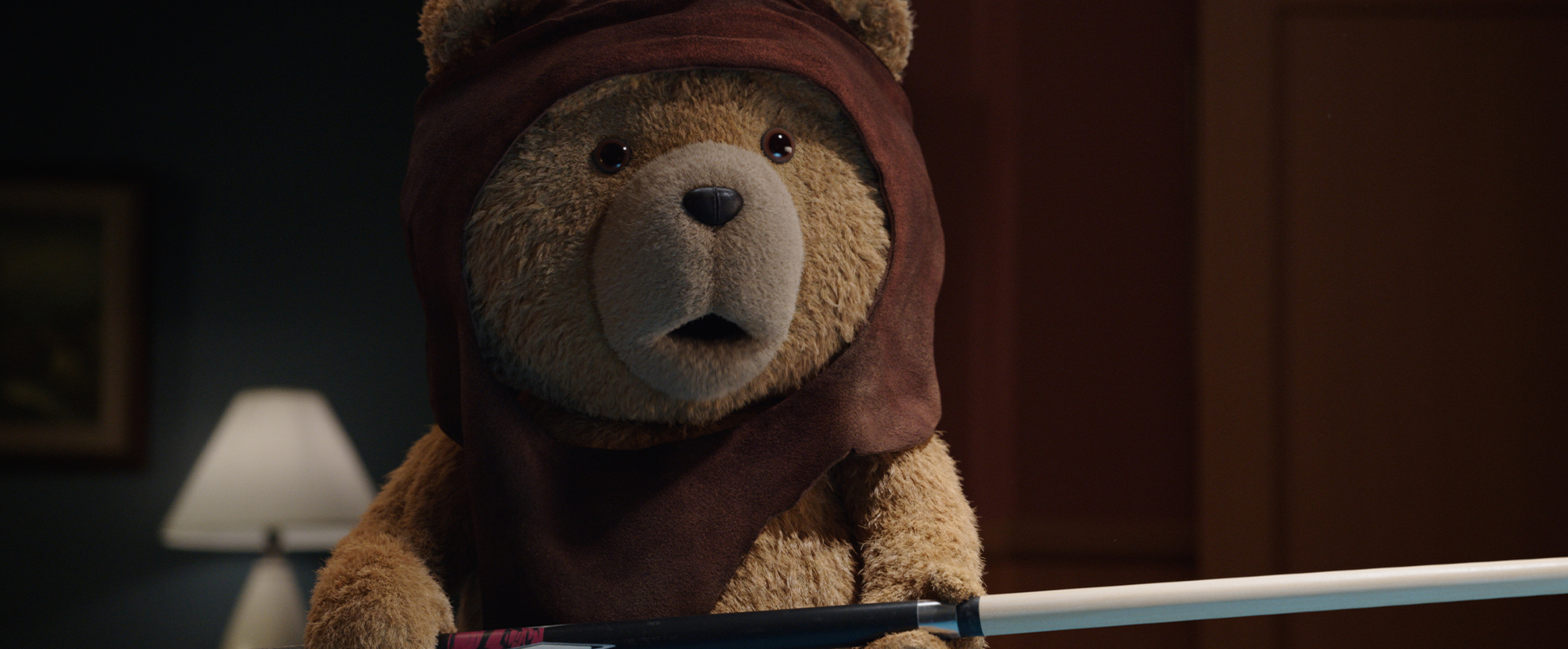 Ted wears a hooded scarf, looking surprised