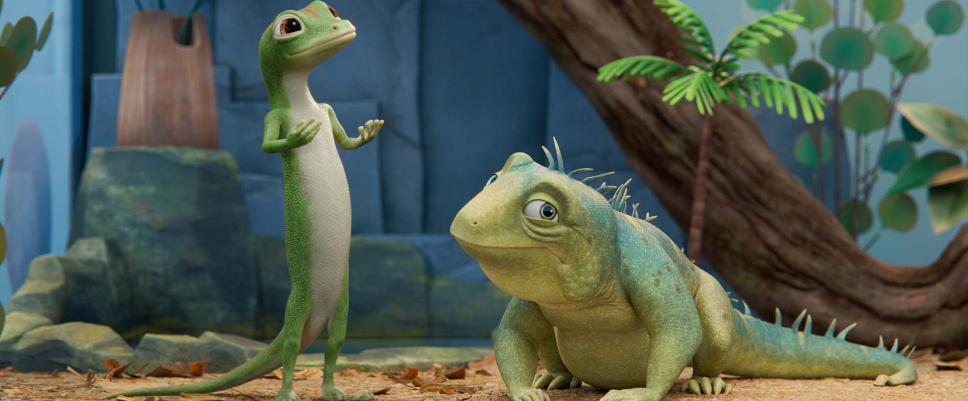 The GEICO gecko stands beside Leo the Lizard