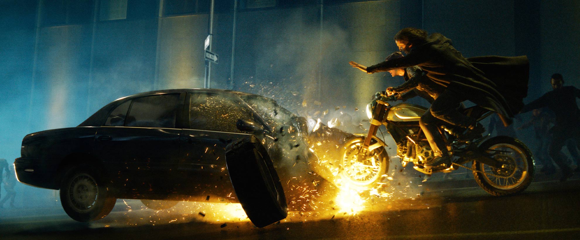 Neo and Trinity on a motorbike, crashing into an exploding CGI car