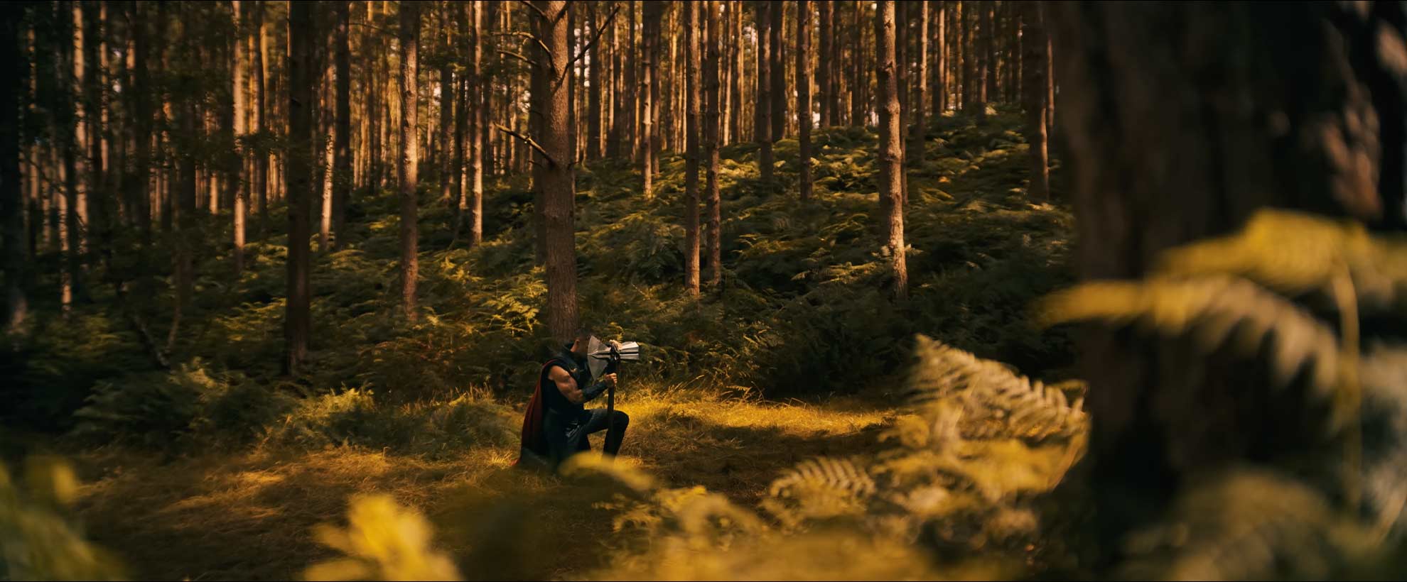 Chris Hemsworth as Thor in Avengers: Doomsday, kneeling in a forest