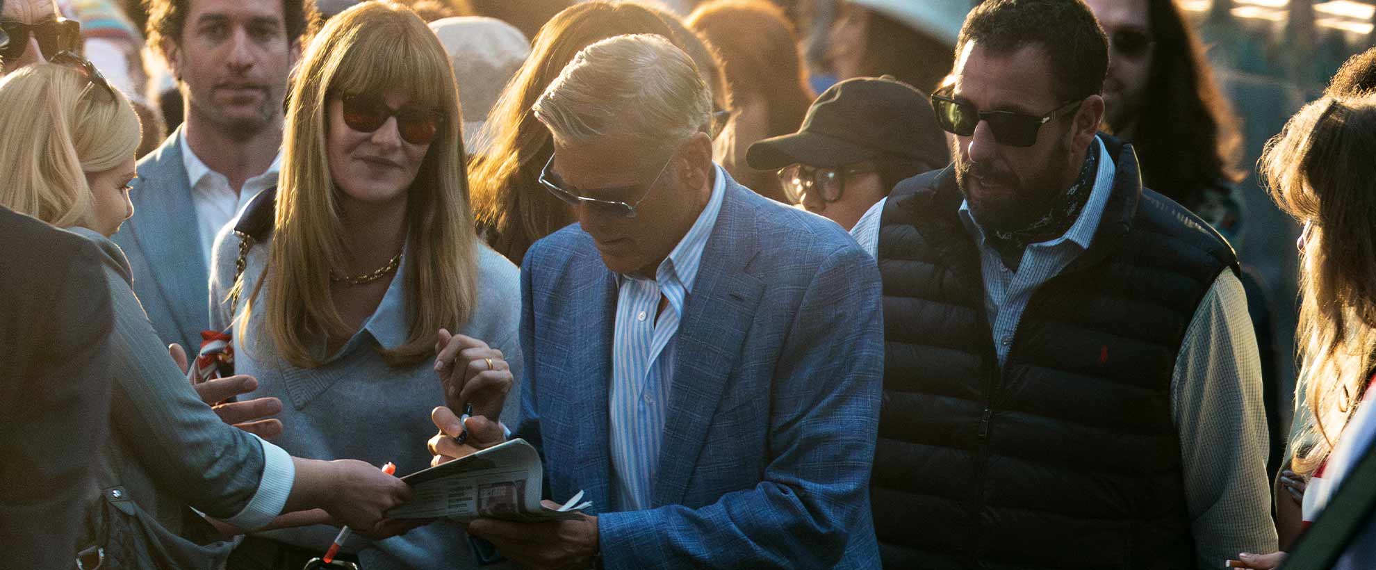 George Clooney signs autographs as Jay Kelly