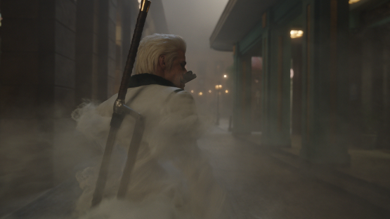 Smoker walks through a foggy street at night