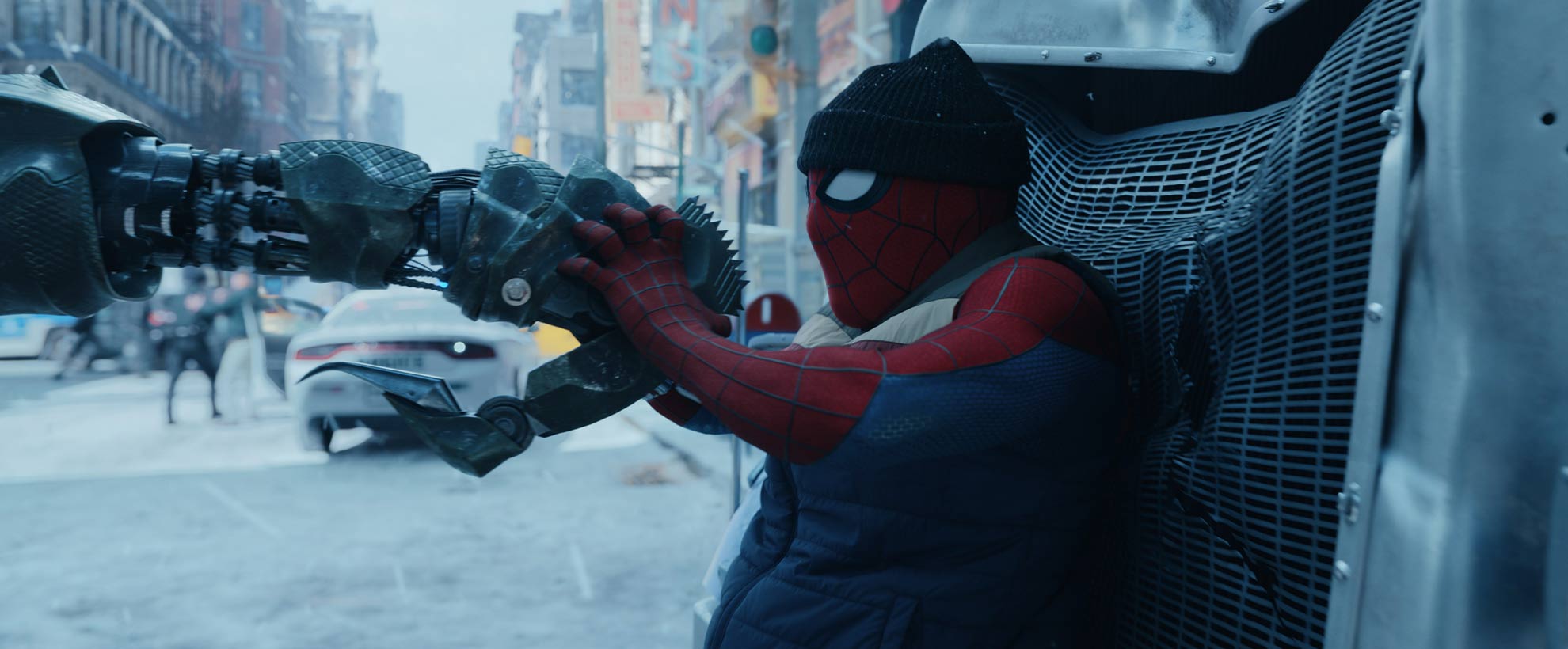 Spider-Man stops a CGI mechnical scorpion tail