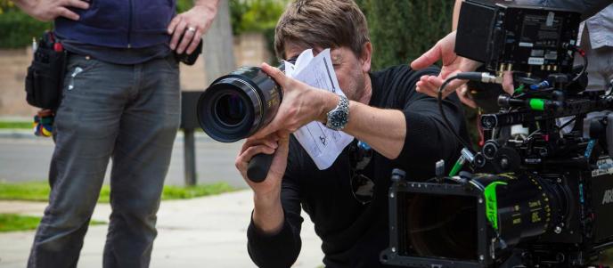 Framestore Pictures Director holding a large camera lens