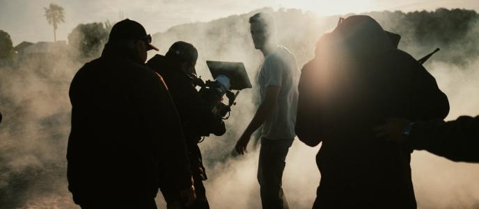 Framestore Pictures Director on set in the USA, filming a man in a misty field