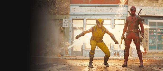 A still from Deadpool and Wolverine showing VFX explosions and the title characters in battle poses. 