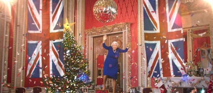deep fake of the queen under a giant disco ball jumping mid air as confetti surrounds her