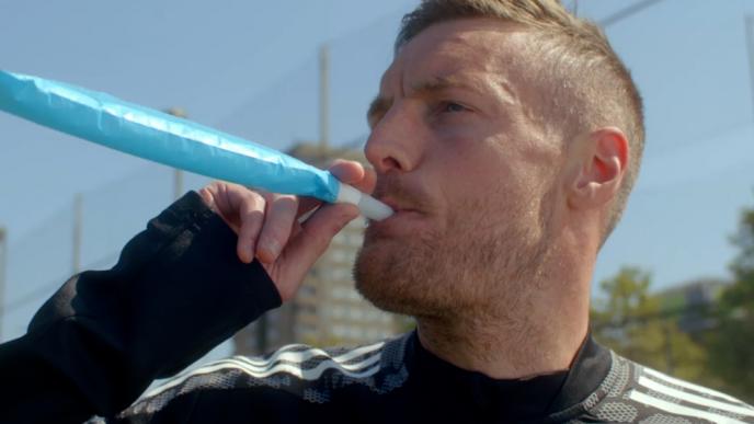 close up shot of a footballer blowing a party horn