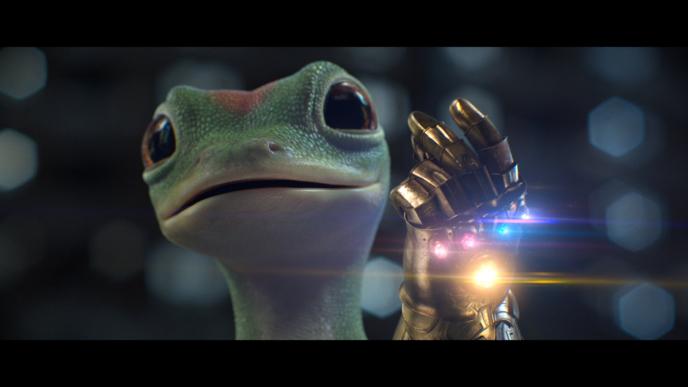 cg animated geico gecko mascot wearing a gecko sized infinity gauntlet from the avenger. it is about to click its fingers