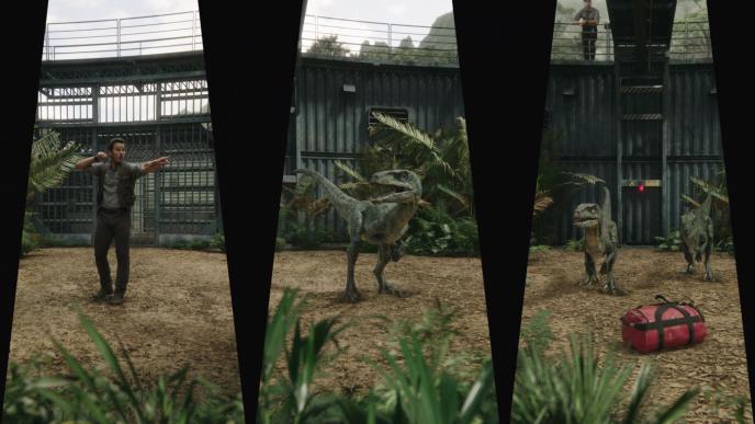 chris pratt pointing ahead while training three raptors in captivity