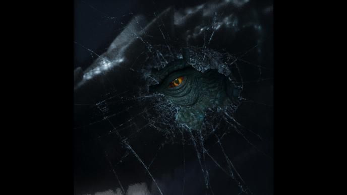a t-rex eye looking directly at you through broken glass