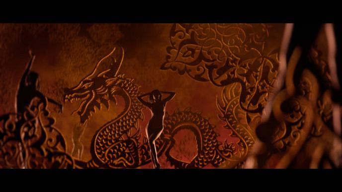 animation of a naked women posing in a paisley and dragon ordained background
