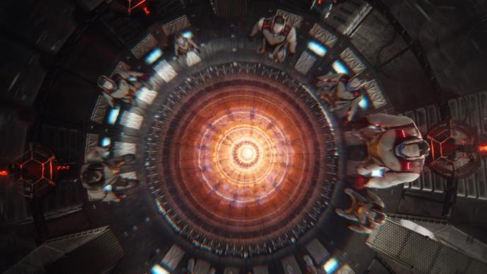 the avengers wearing full body armour suits and helmets while sitting in the ant man's quantum van as the centre lights up