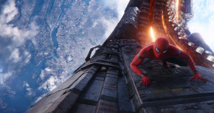 spider-man crawling up a q ship spacefaring vessel in infinity war out in space as earth is visible in the background