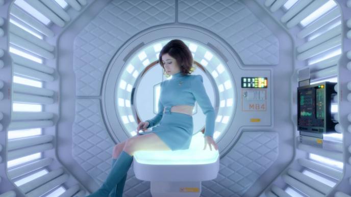 actress cristin milioti as nanette cole sitting on an illuminous seat inside of the uss callister