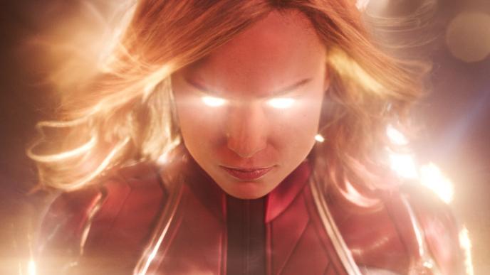 face close up of captain marvel with illuminous eyes staring directly into the camera