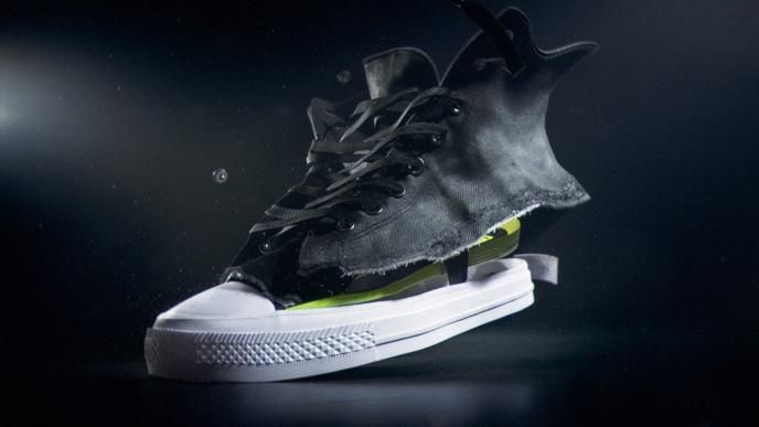 a converse shoe broken apart in layers, revealing the material