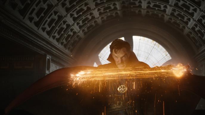 actor benedict cumberbatch as doctor strange looking fiercely focused as he conjures magic and creates sparks in his palms