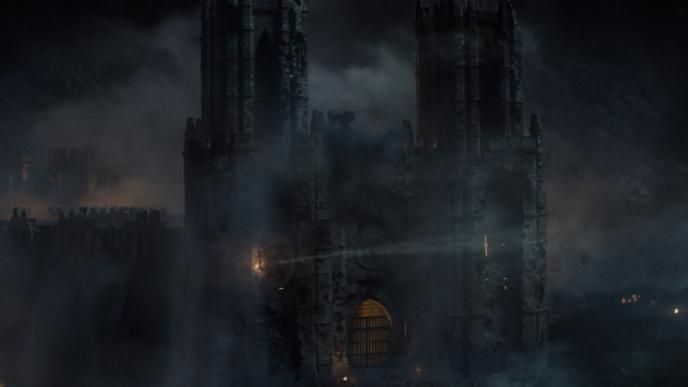 castle dracula under attack covered in smoke