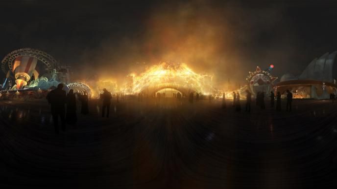 front view of the dreamland boulevard entrance ablaze at night as silhouttes of people stand by