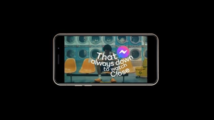 a phone flipped on its side that has the text 'that always down to watch close' in the centre