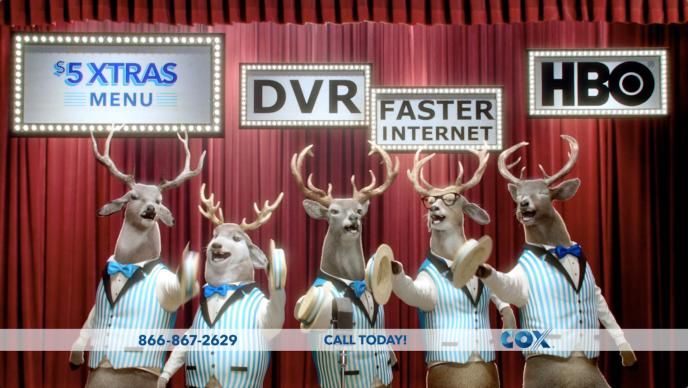 five cg animated reindeer bucks wearing striped quintet waistcoats. they are standing in front of a red stage curtain