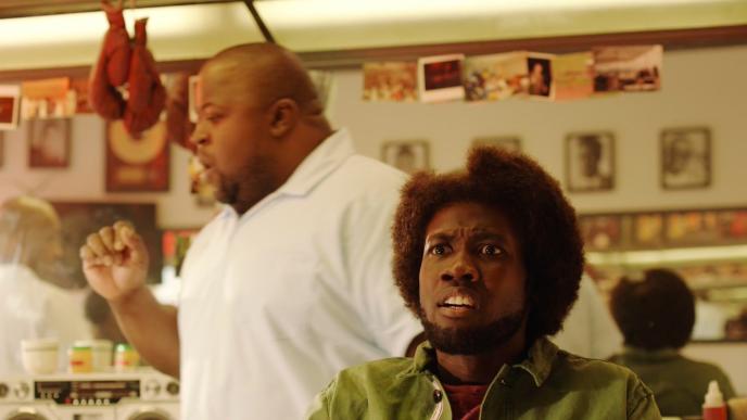 a person at a barber shop looking shocked